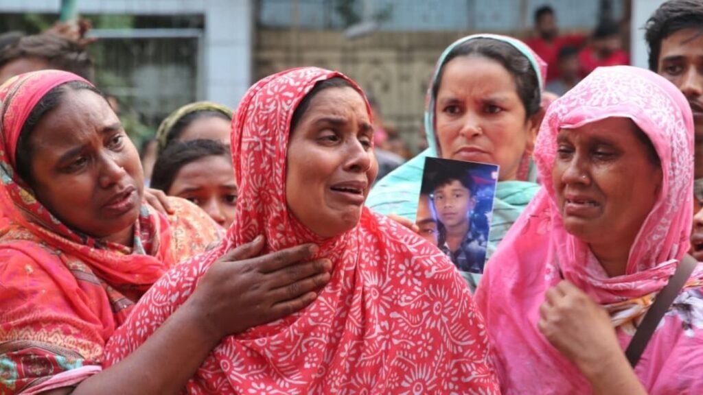 Relatives of workers who lost their lives in a fire mourn. Photo: DSJ Archive